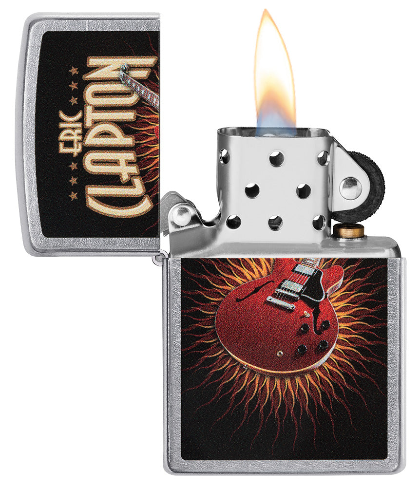 Zippo aansteker vooraanzicht chroom open en aangestoken met gekleurde afbeelding van een rode gitaar van Eric Clapton