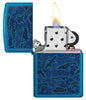 Zippo aansteker vooraanzicht geopend en aangestoken in hoogglans blauw met illustratie van zeedieren in de stijl van Aboriginal kunst.