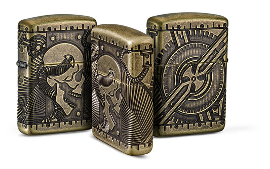 Gegroepeerde aanzicht Zippo-aansteker messing antiek met diep gegraveerd doodshoofd met mechanische elementen